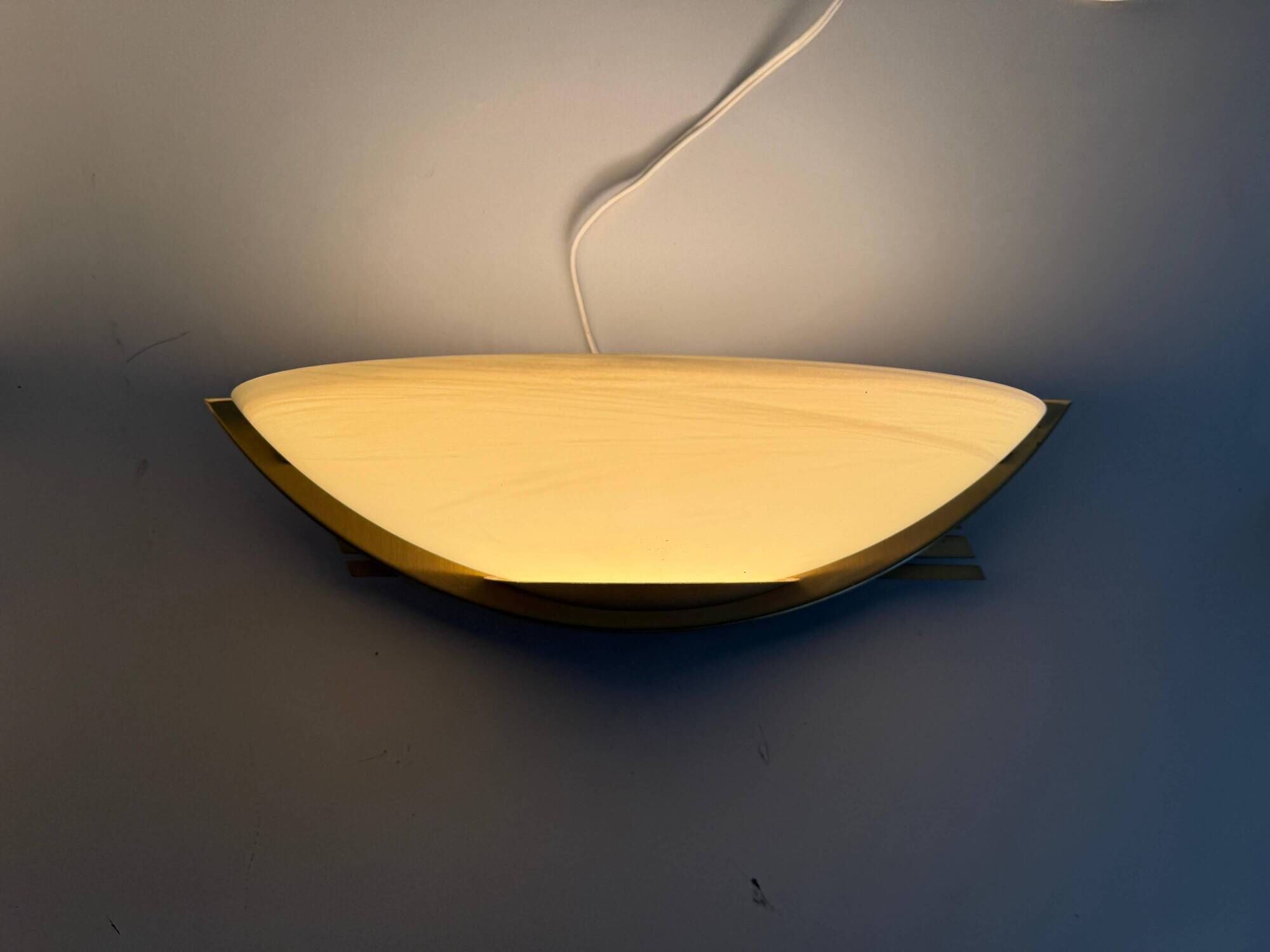 Pair of brass and glass wall lights from the Spage era, 1980, Germany.
