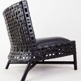Pair of black woven leather lounge chairs
