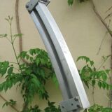 Lampadaire Arc - télescopique - piètement en travertin -