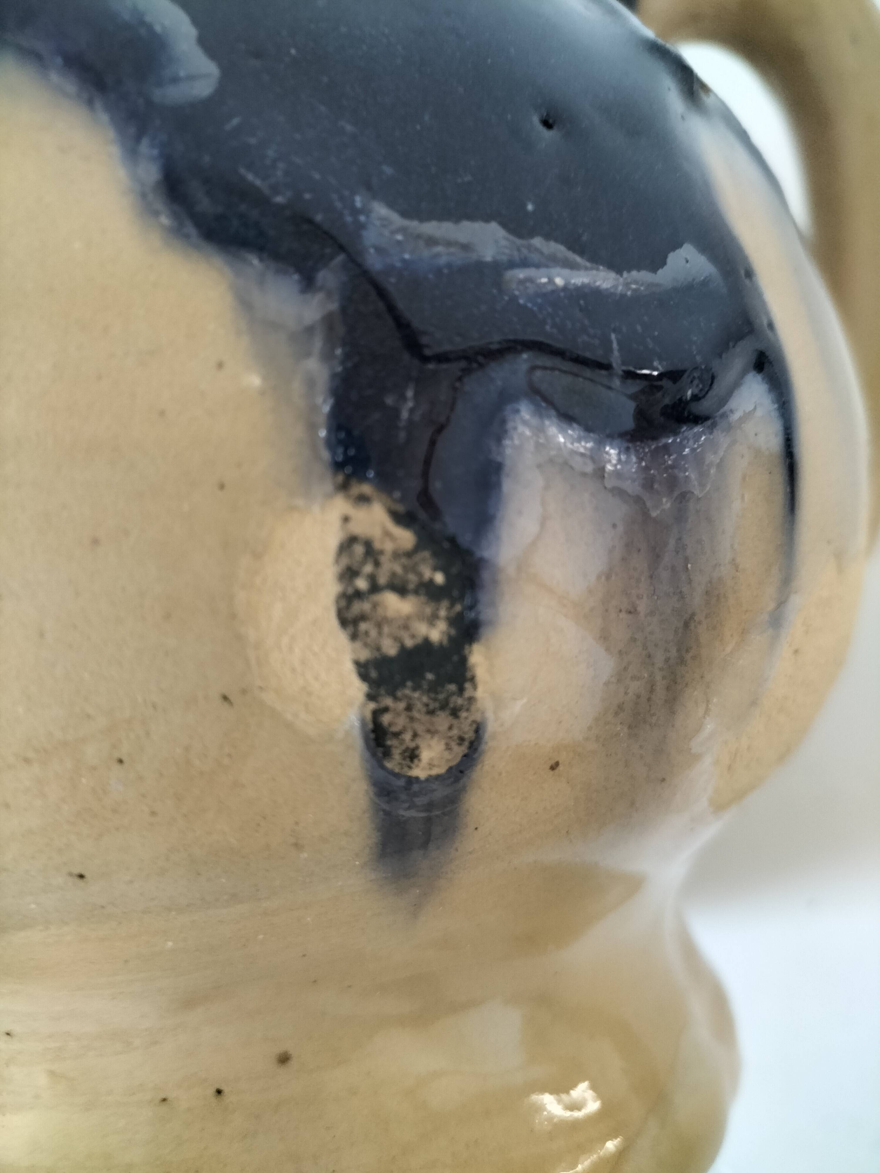 handcrafted ceramic jug with navy blue drip glaze.