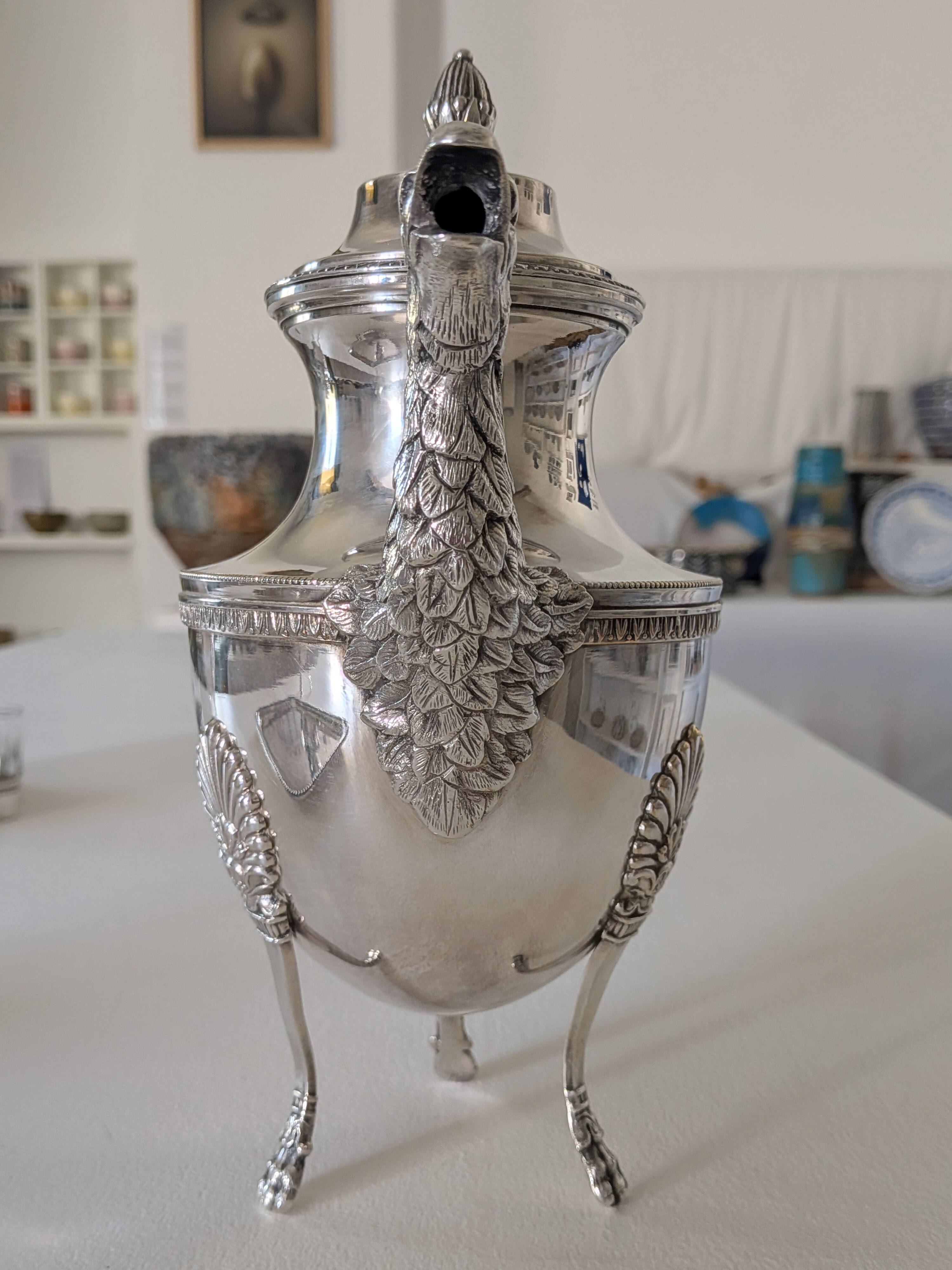 Empire-style silver-plated coffee pot with eagle head spout.