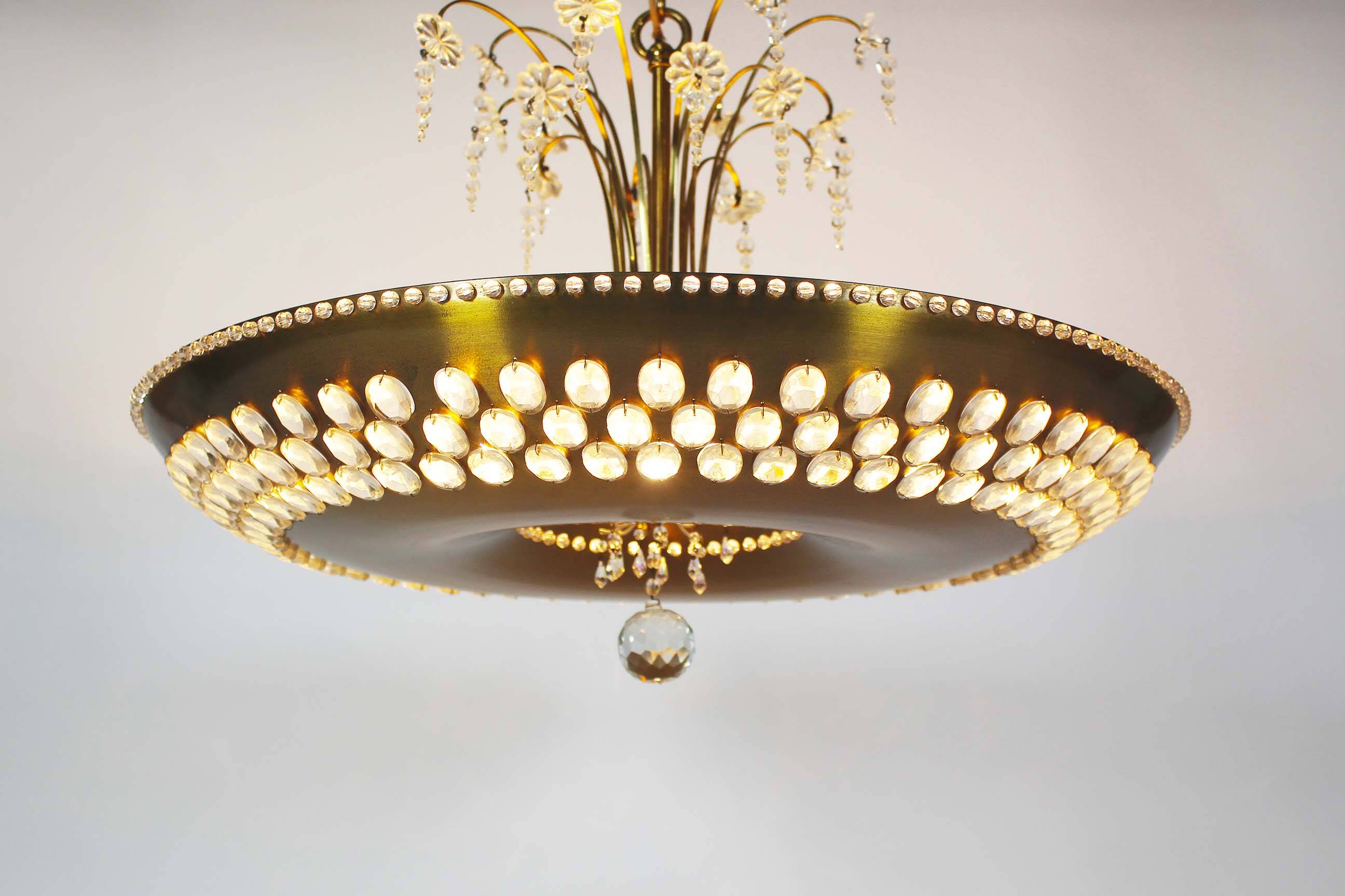 Monumental brass and crystal chandelier from Palwa