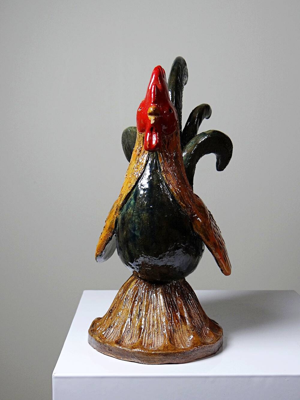 Small decorative rooster in handcrafted enameled ceramic folk art