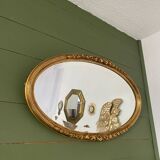 Miroir mural ovale doré