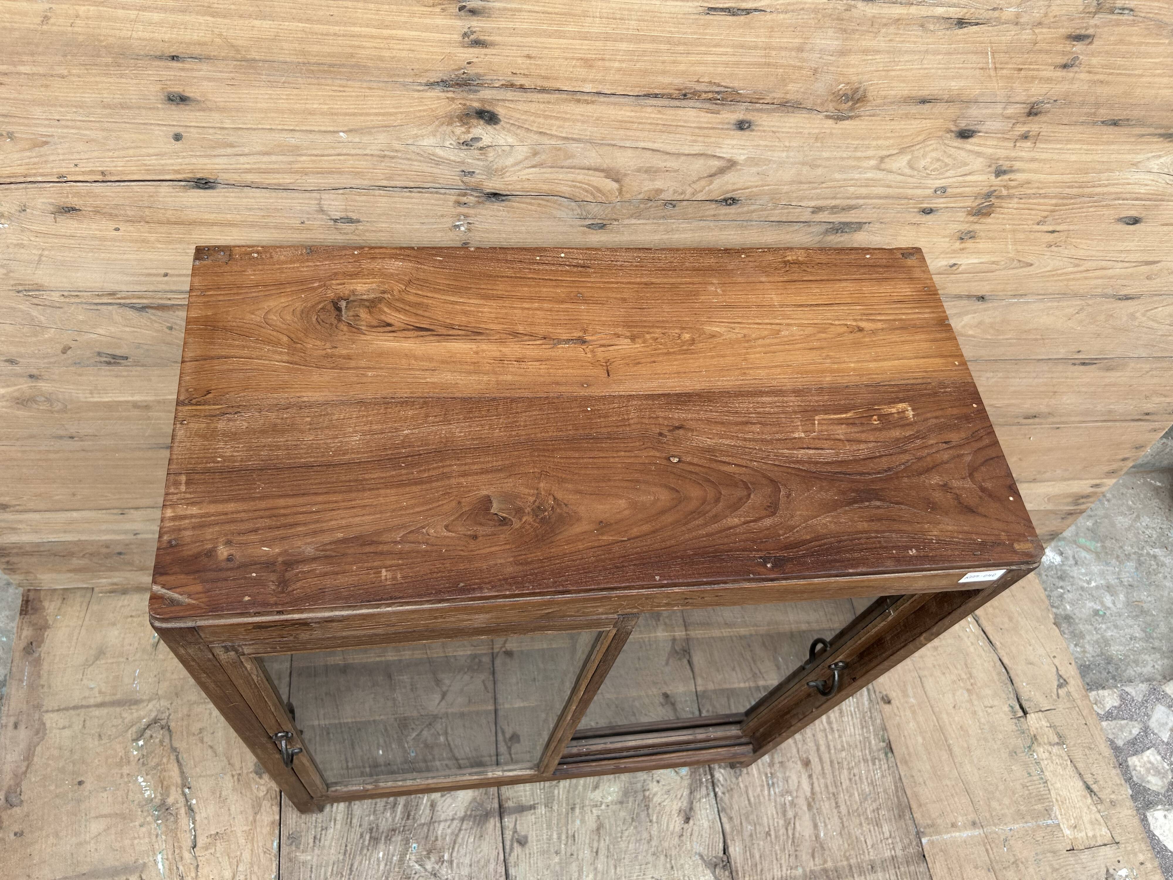 glass-fronted buffet in Burmese teak