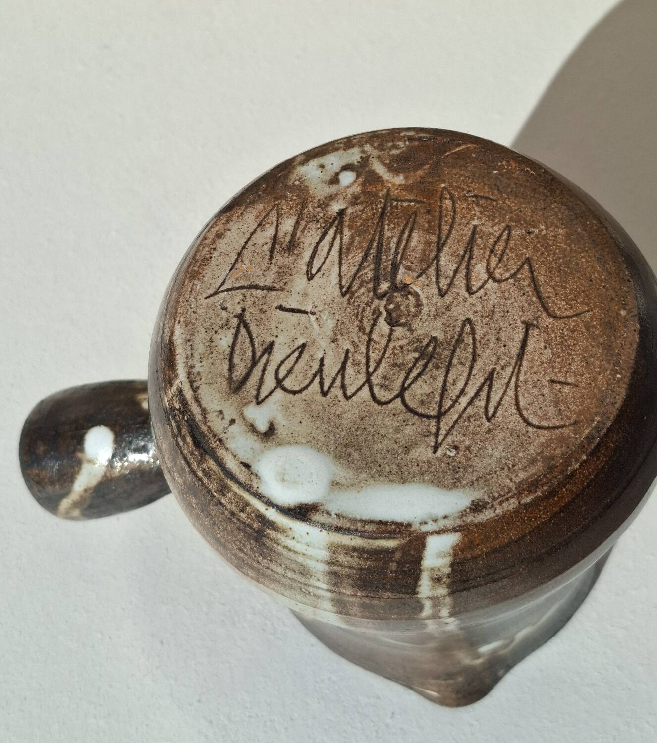 Stoneware pitcher signed by Jacques Pouchain.