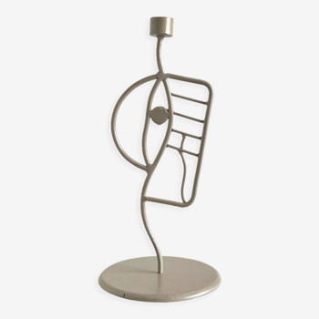 Hand-curved beige metal candle holder