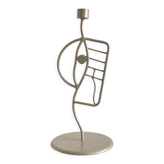 Hand-curved beige metal candle holder