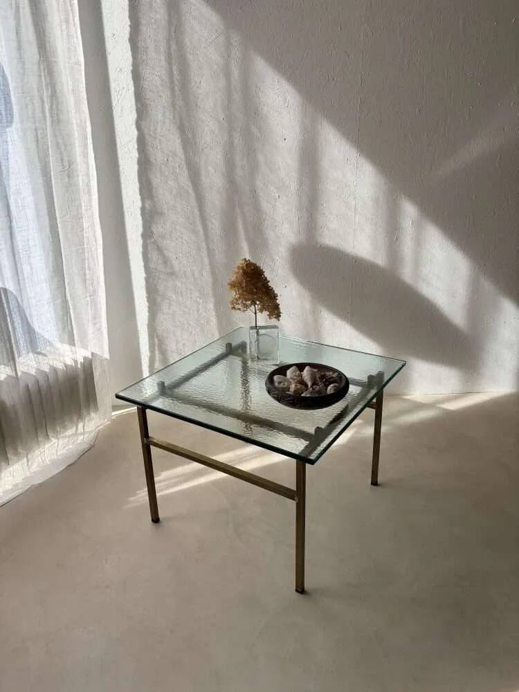 Swedish brass coffee table with a marbled glass top from the 1960s.