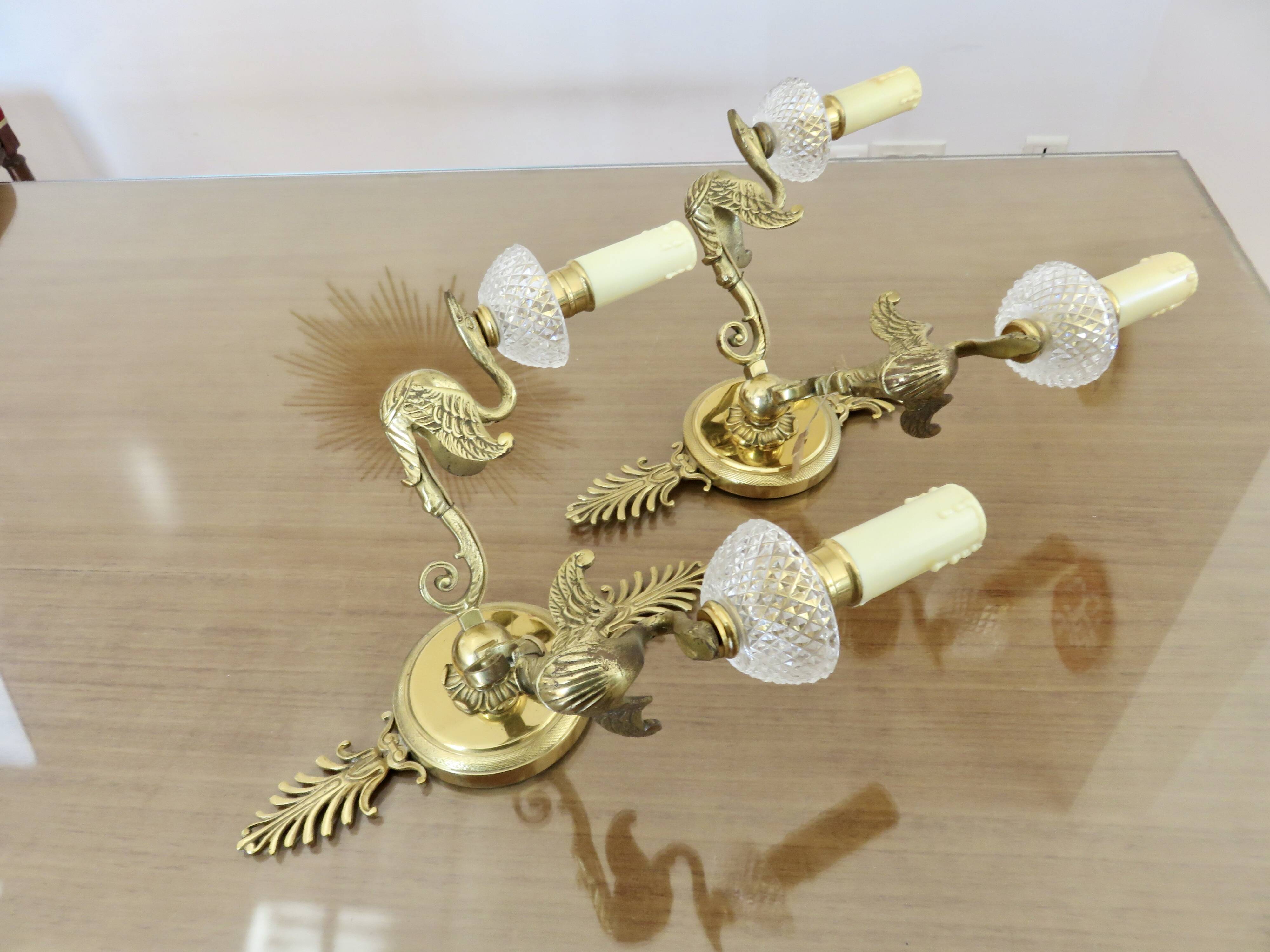 Pair of Lucien Gau "swan" wall lights in gilded bronze with bright gold and crystal
