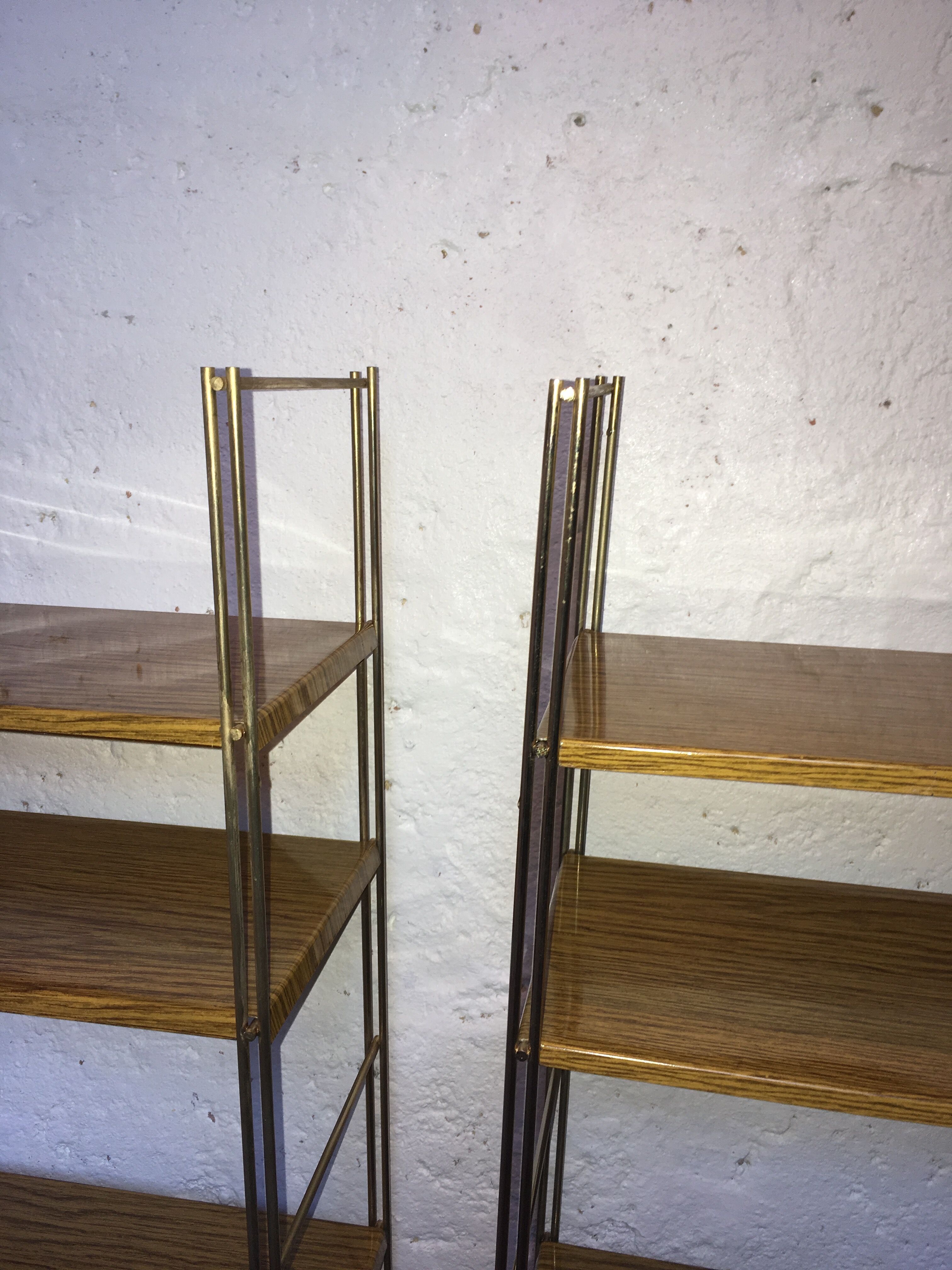 set of two 1960 vintage metal thong shelves.