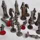 Vintage chess set in patinated metal alloy with a 39 cm chessboard from the 1980s.