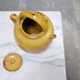 Old gargoulette pot in glazed terracotta
