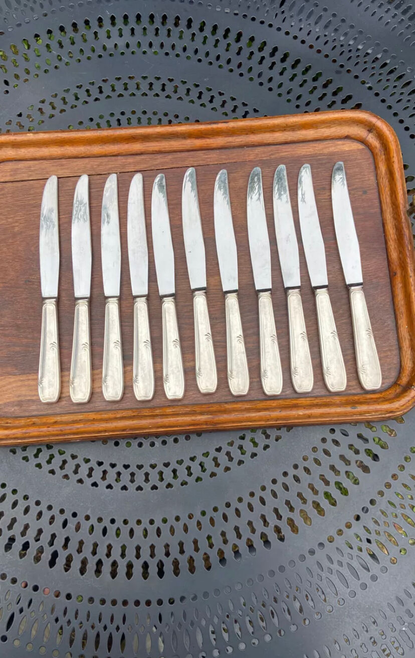 Set of 11 large silver metal knives