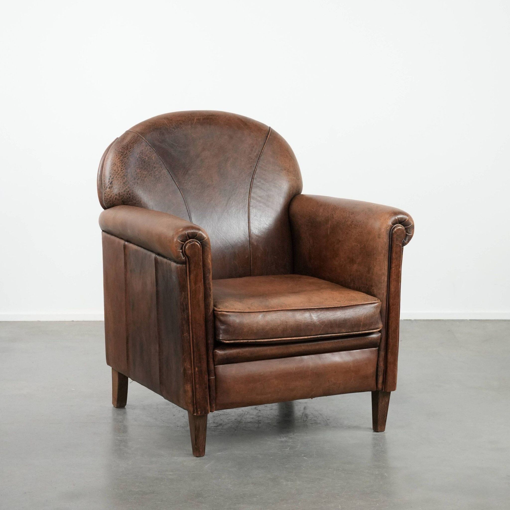 Vintage sheepskin armchair with warm colours and a characterful appearance