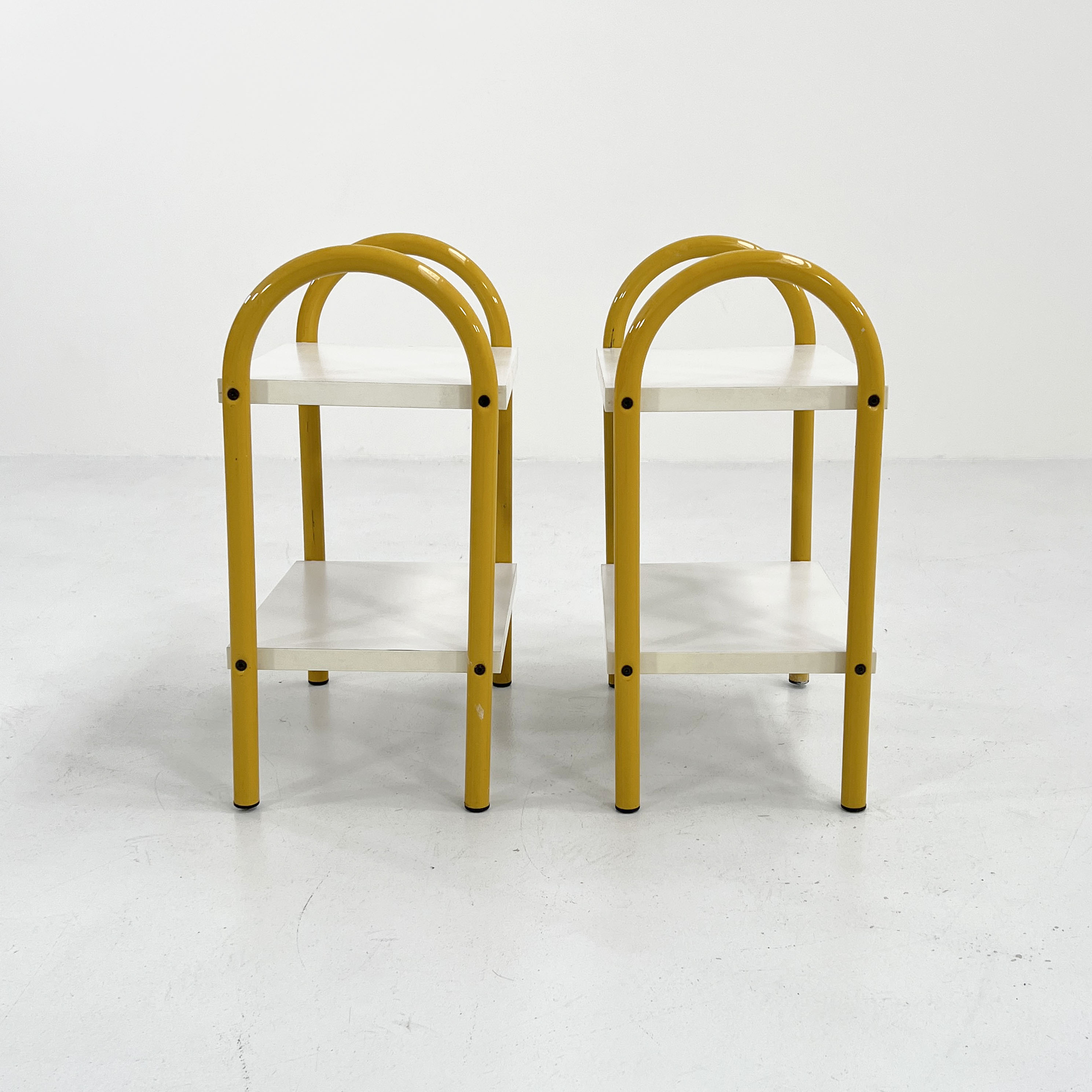 Pair of yellow tubular bedside tables, 1980
