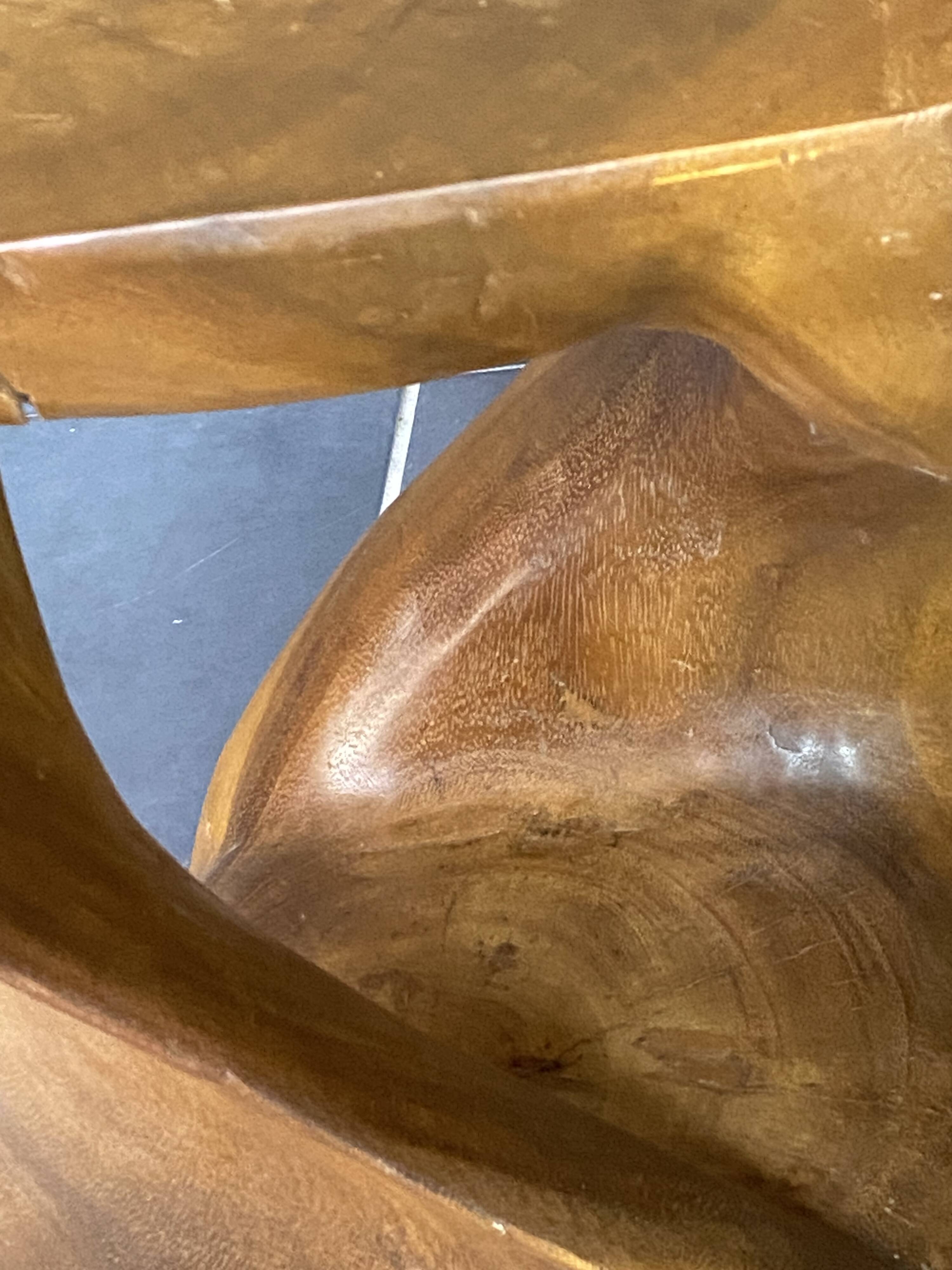 Stool no. 1 in solid raw walnut wood, carved from the mass, 1970.
