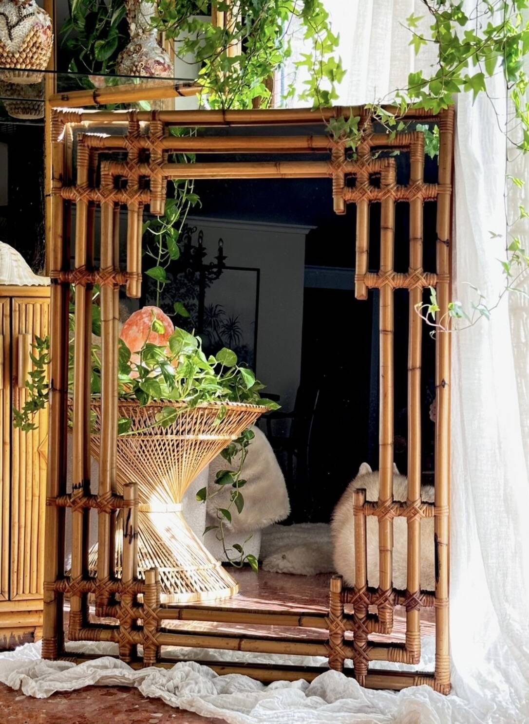 Large sculptural mirror handmade from natural bamboo and woven rattan, 1960.