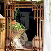 Large sculptural mirror handmade from natural bamboo and woven rattan, 1960.