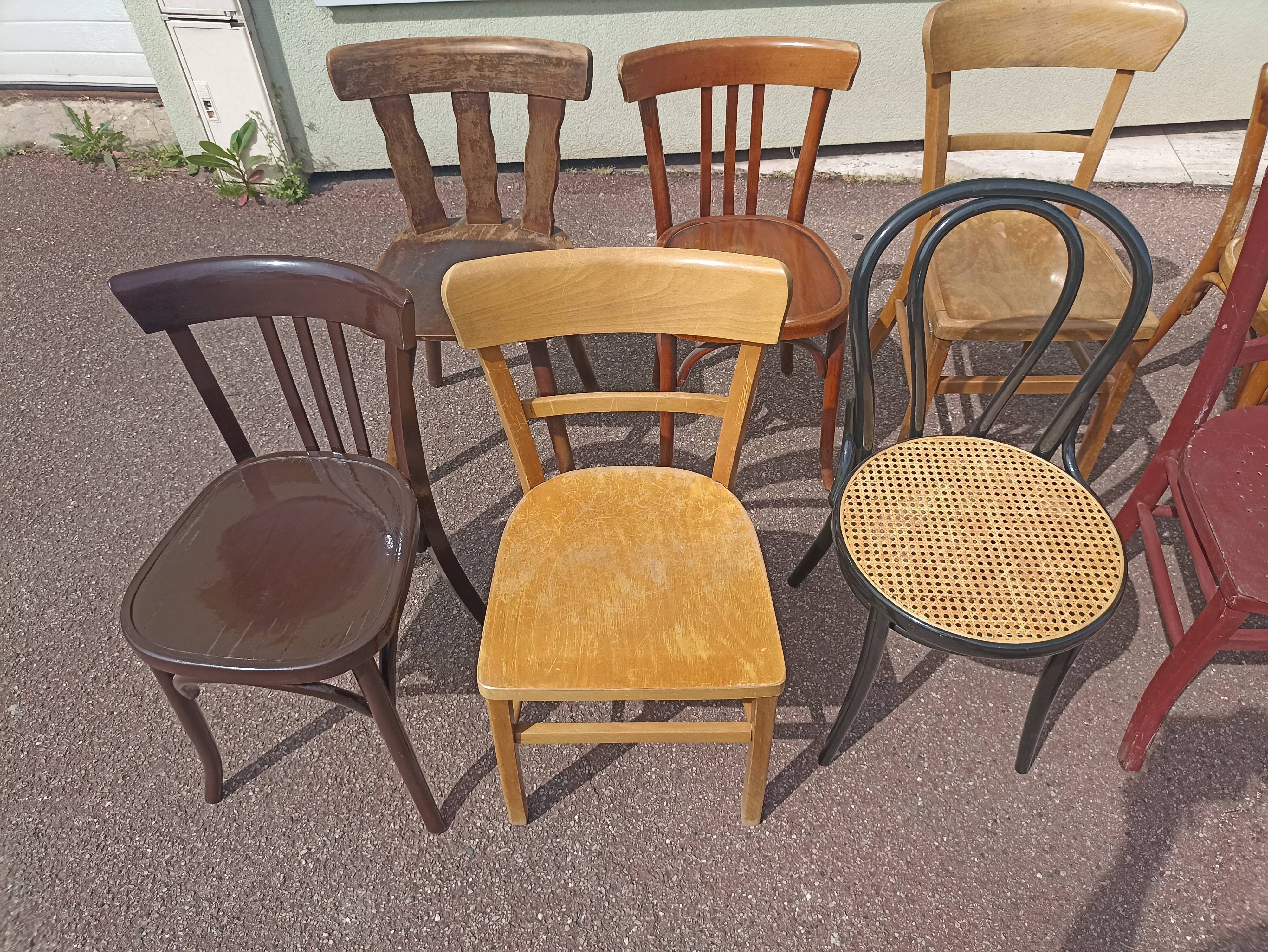 Set of 12 mismatched wooden bistro chairs