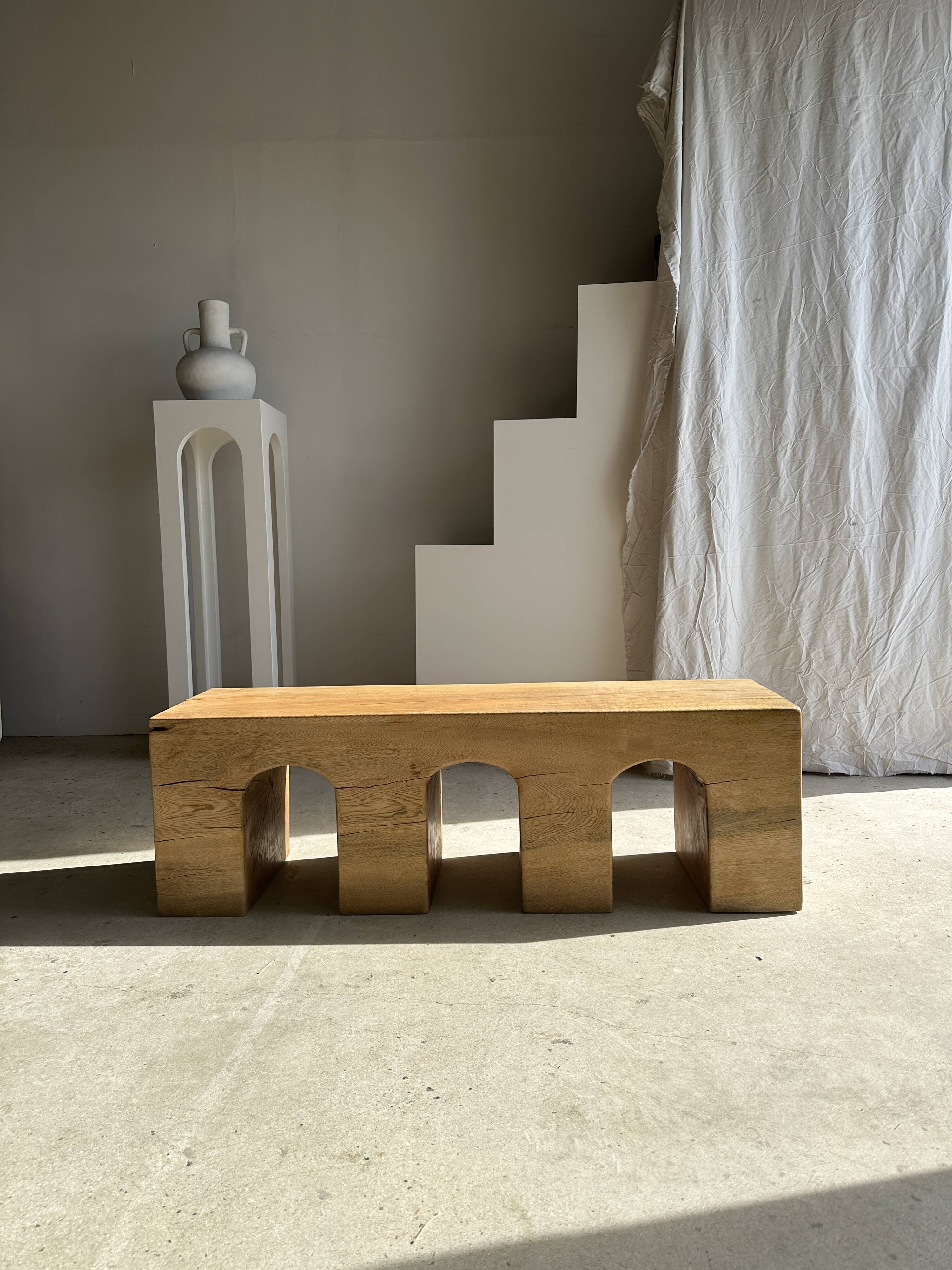 Solid monoxyl wood bench with carved 3-arch base - Natural wood color