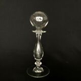 Glass oil lamp blows on foot shower