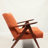 Vintage orange curly armchair Scandinavian design 1970