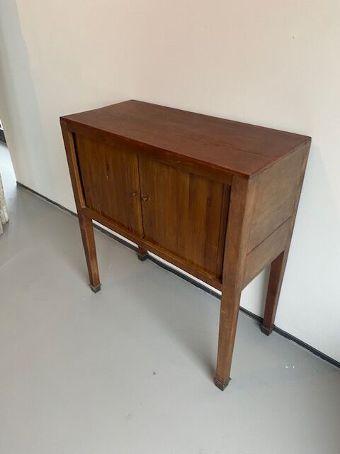 Old wooden cabinet with extendable doors