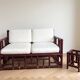Two-seater sofa set and small lacquered violet rattan table.