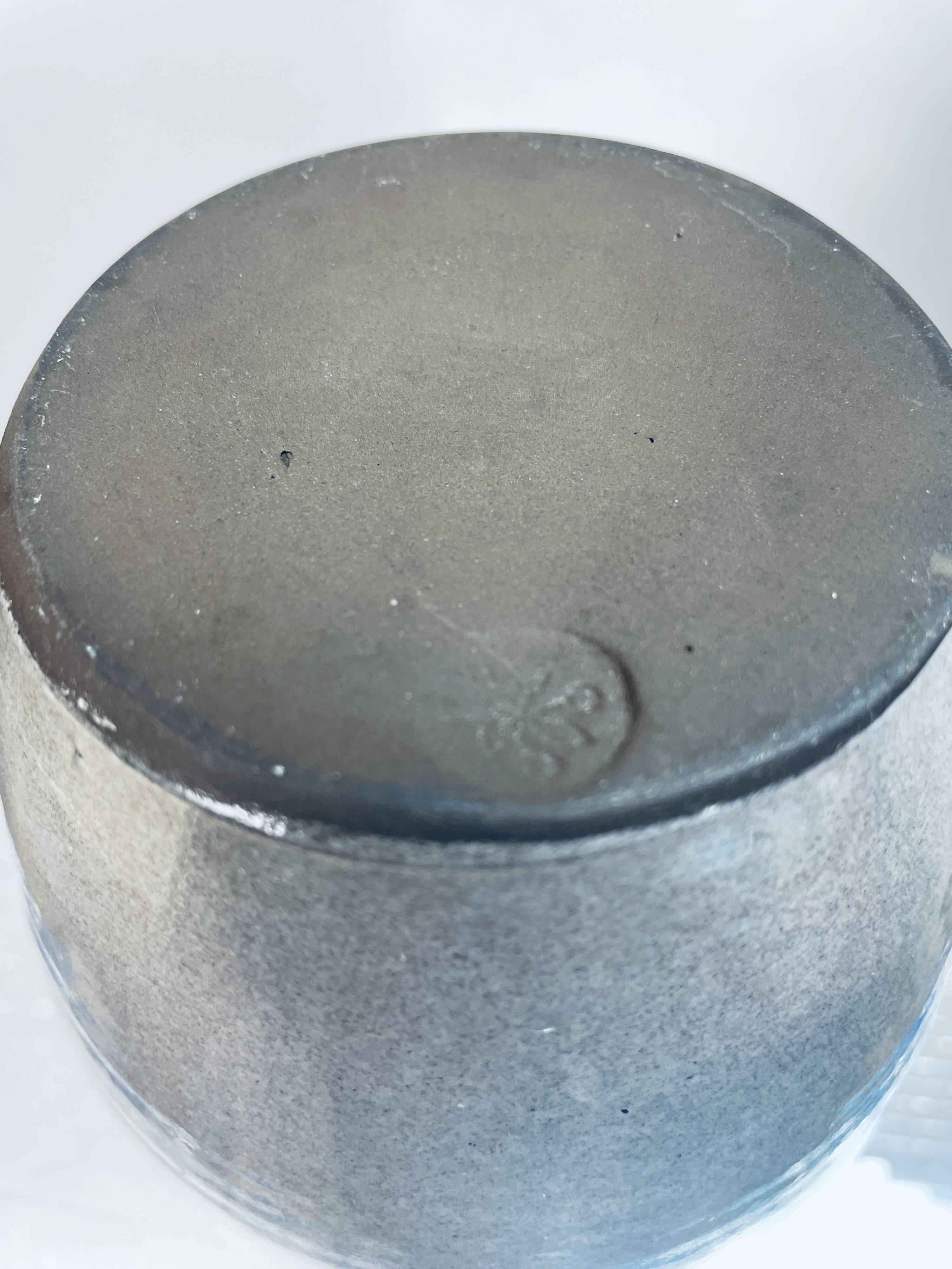 Handcrafted gray stoneware vase with child illustration