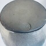 Handcrafted gray stoneware vase with child illustration