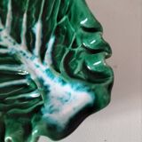 Vintage green slipware bowl in the shape of a cabbage leaf.