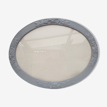 Old medium-sized oval frame in old grey wood color with patterns