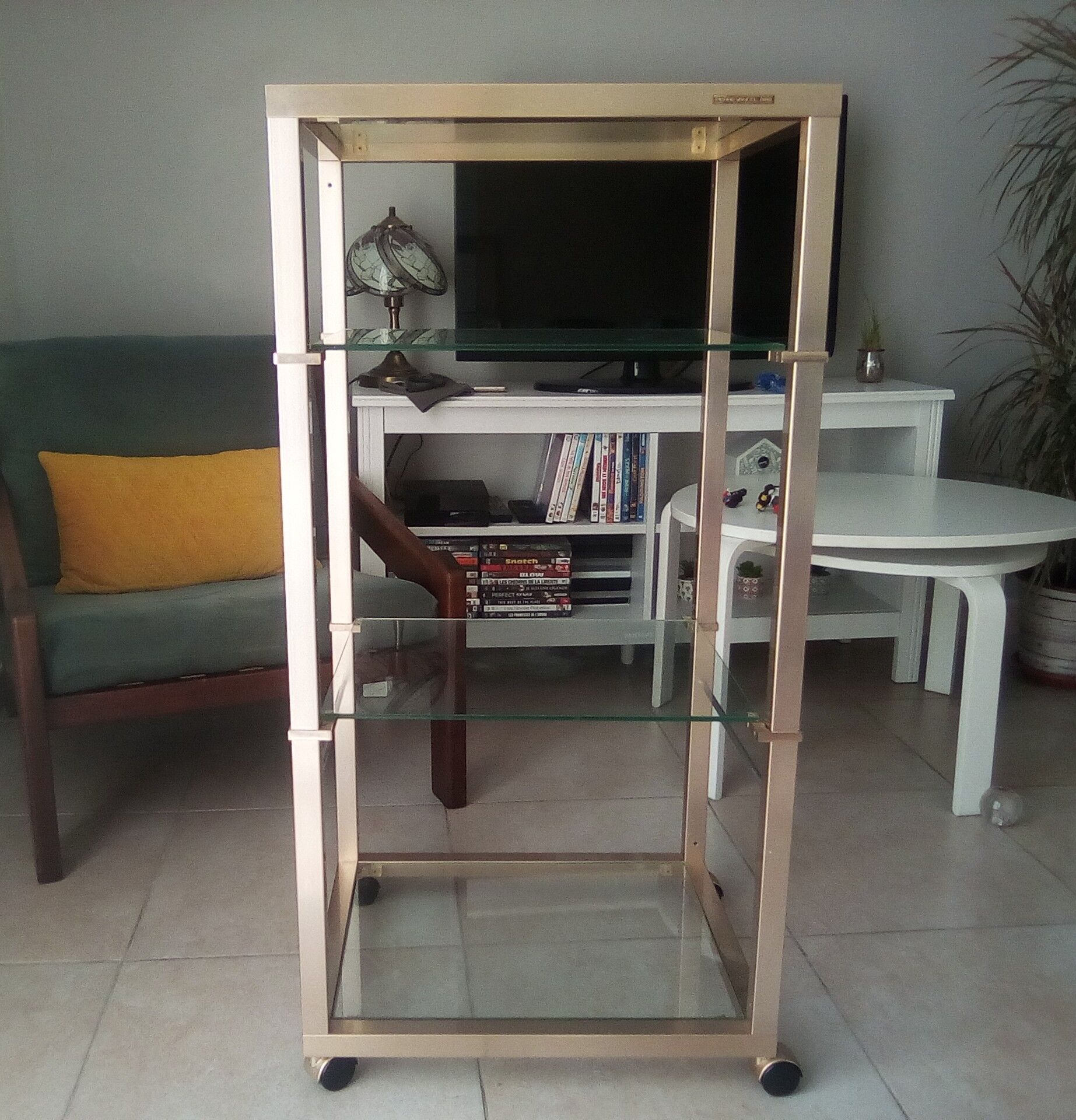 Brass shelf and glass on wheels Pierre Vandel