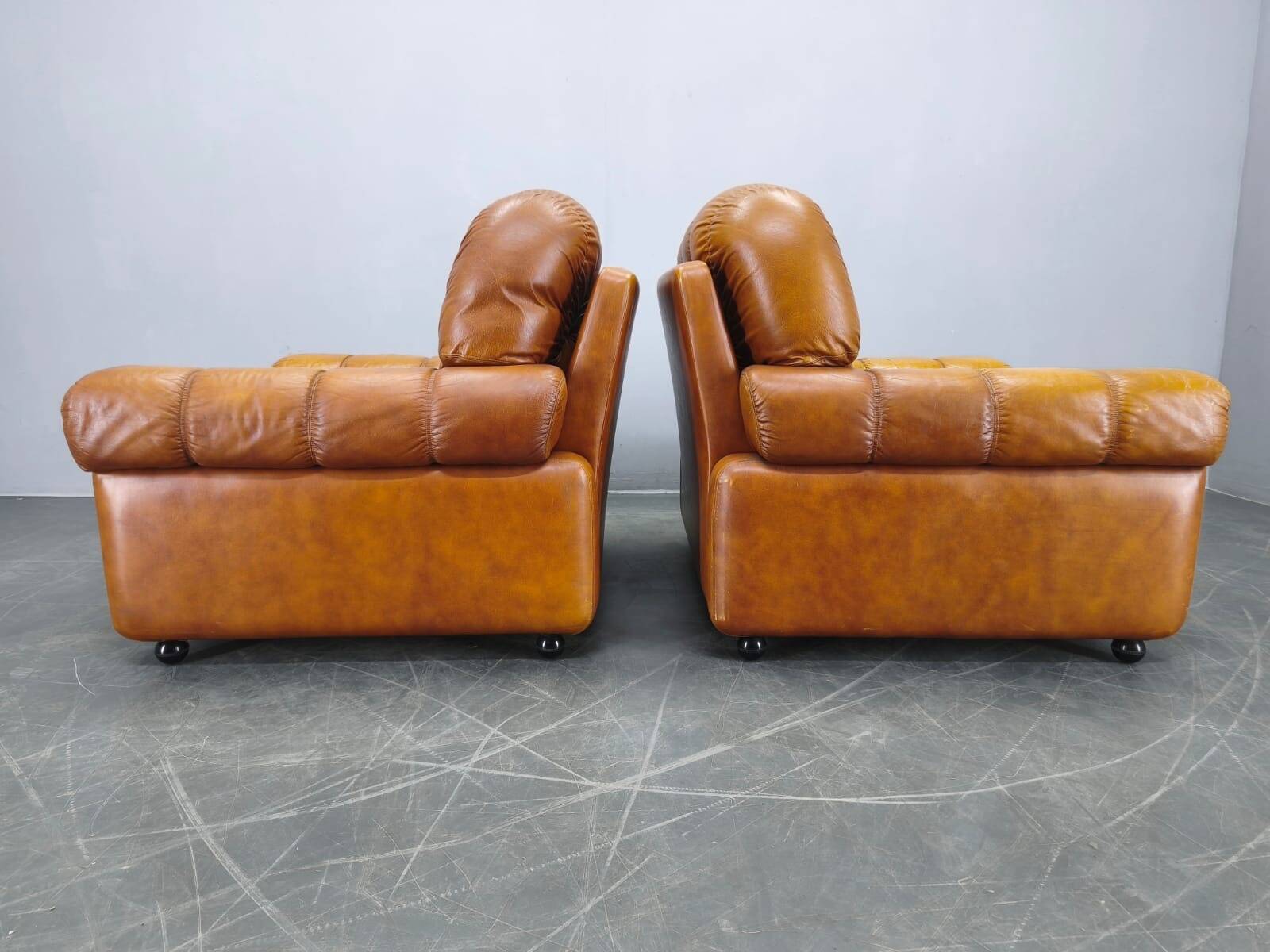 Pair of modern Italian armchairs from the mid-20th century, cognac leather, 1970.