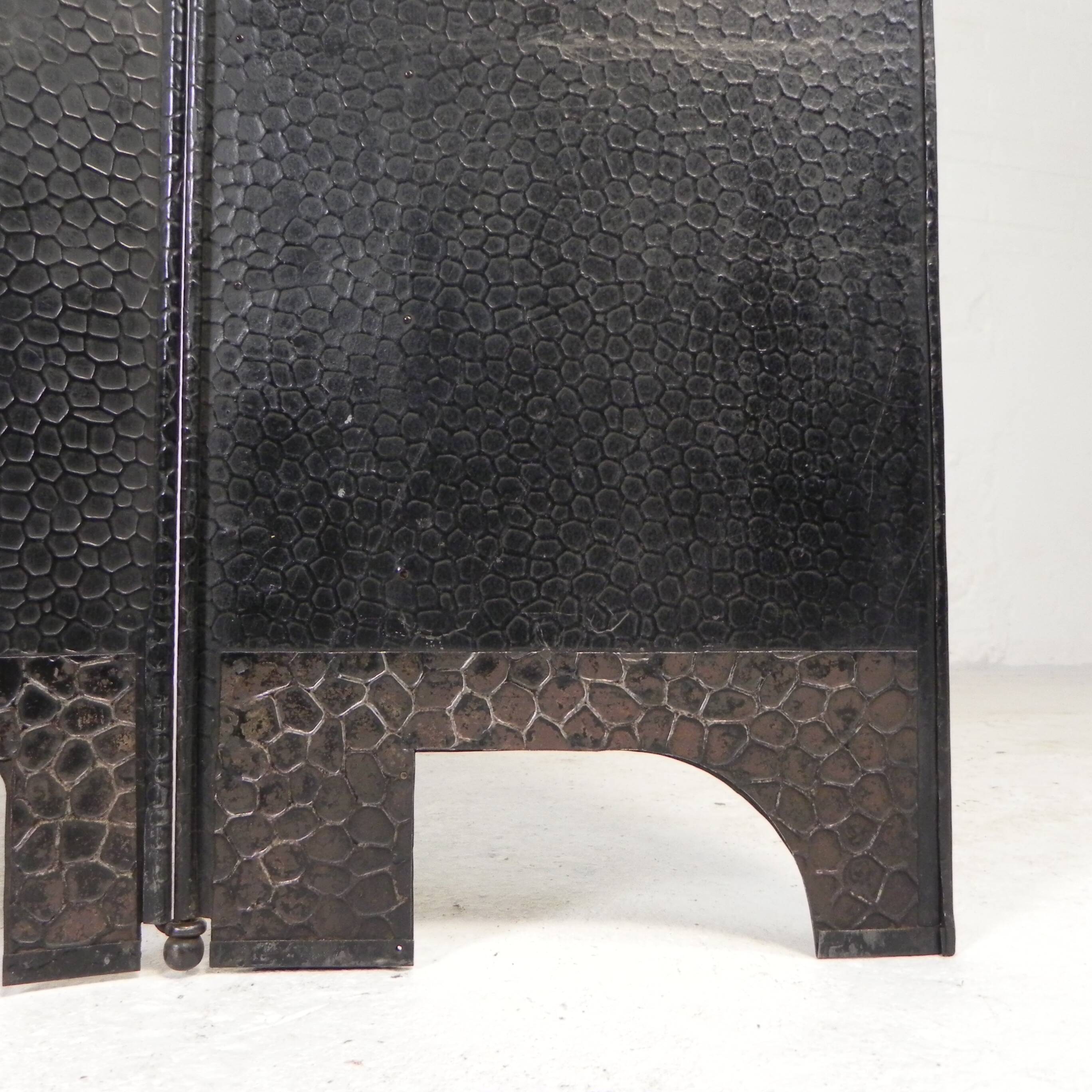 Art Deco screen in steel with brass details, 1930s.