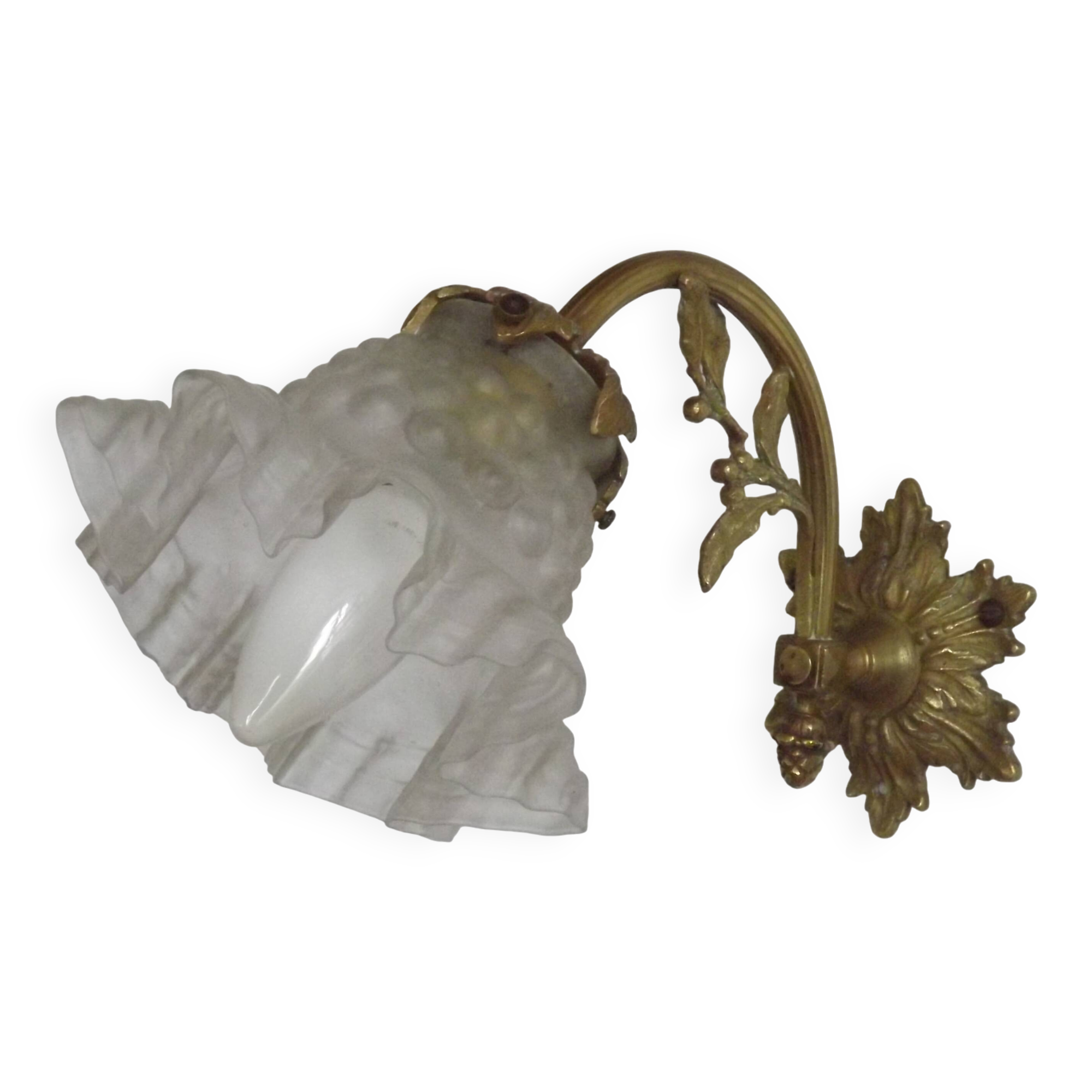 Simple wall sconce in French Art Nouveau bronze with a white glass shade featuring patterns.