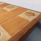 Barrois vintage shell-patterned comma coffee table in wood and ceramic.