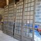Two pairs of solid oak doors with small panes.