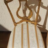 Pair of chairs with a golden lyre