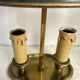 A pair of old brass bed warmers.