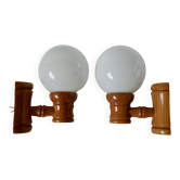 Pair of globe wall lights in pine and opaline from the 60s