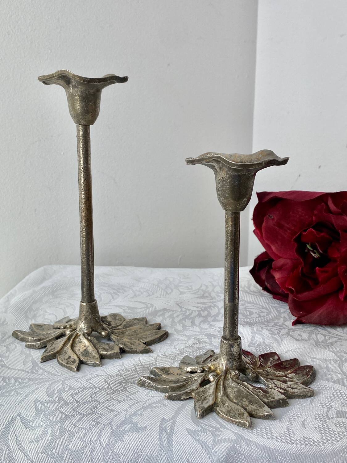 Pair of metal flower candlesticks