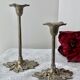 Pair of metal flower candlesticks