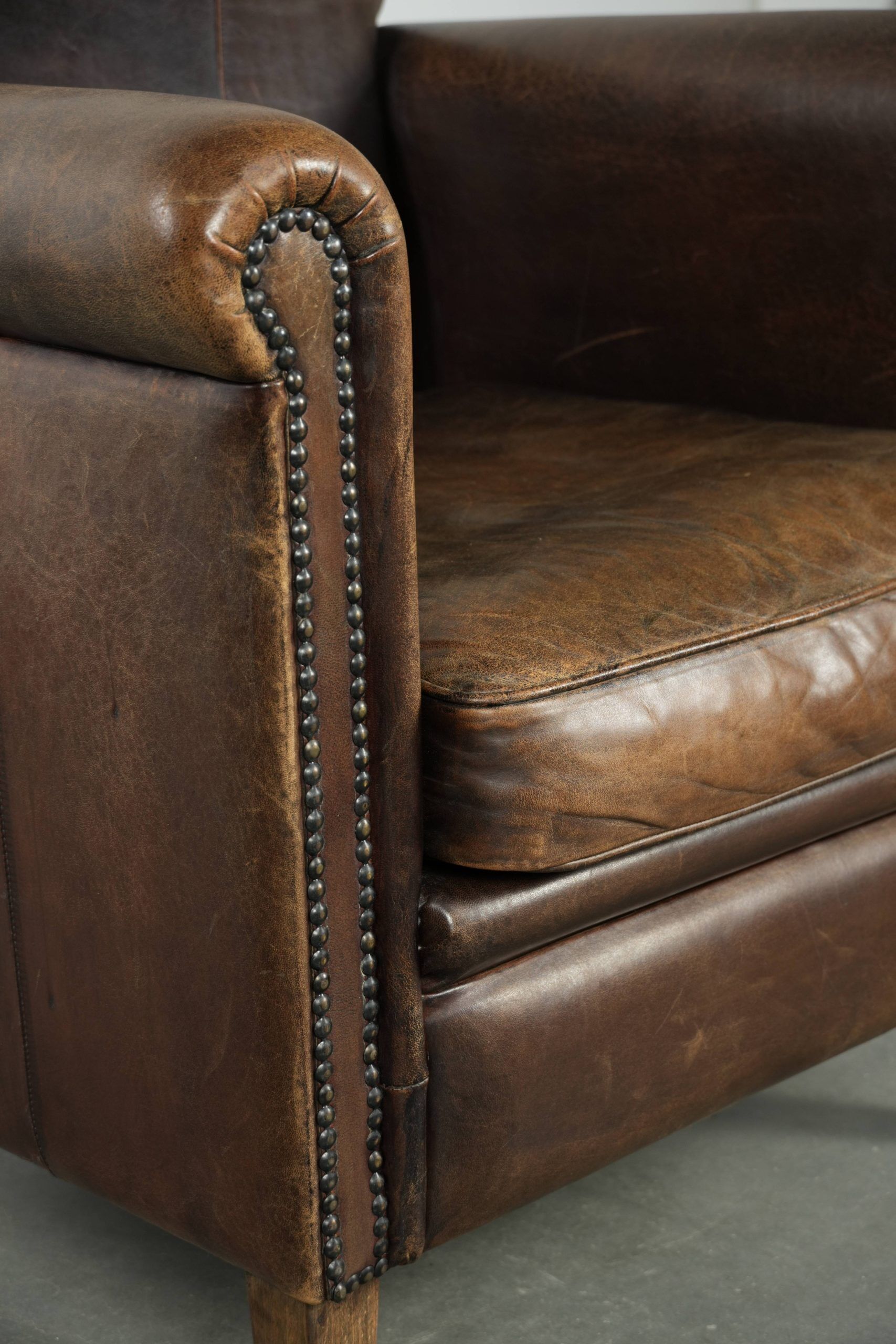 Characterful sheepskin design armchair with beautiful patina