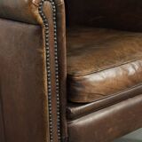 Characterful sheepskin design armchair with beautiful patina