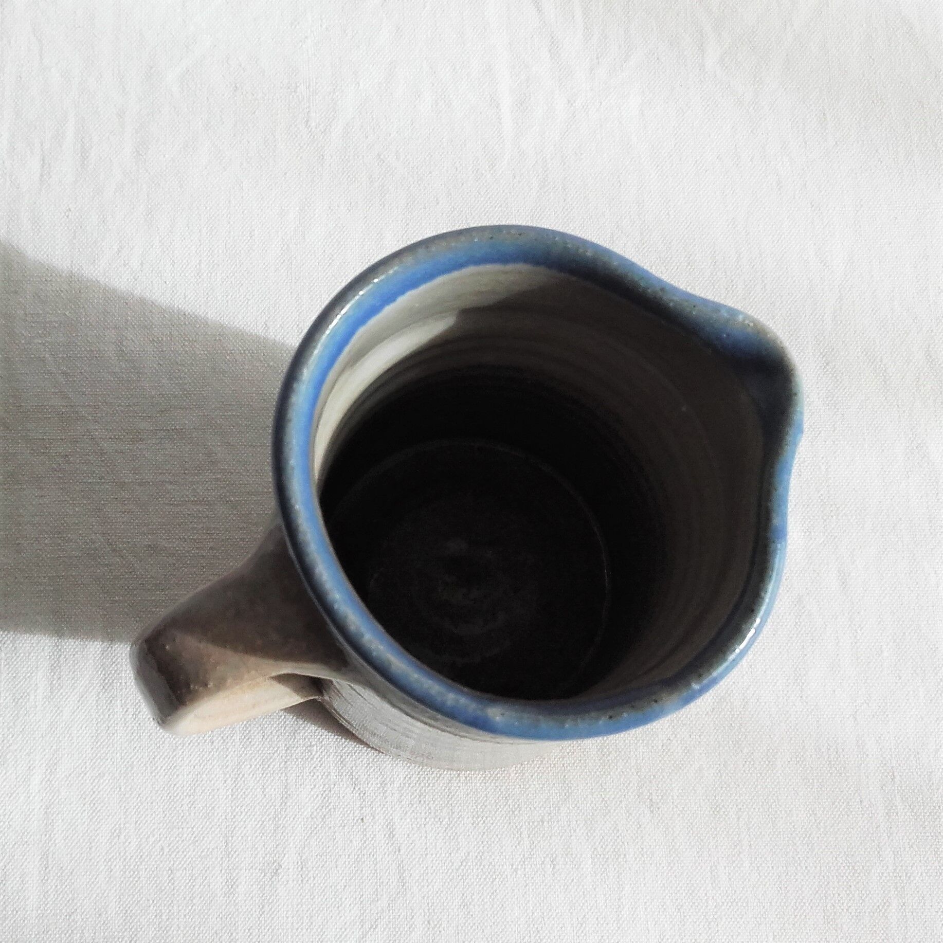 Enamelled ceramic milk pot