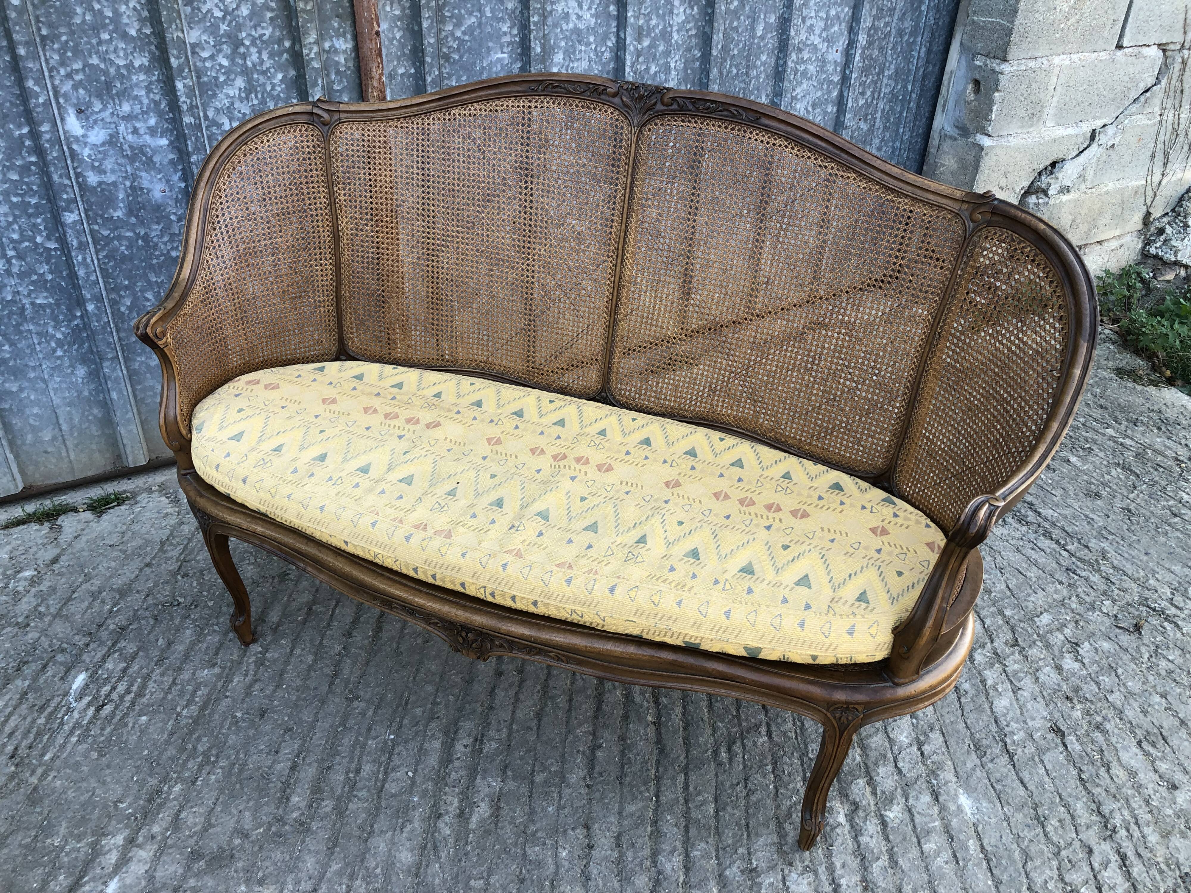 Antique Louis XV bench in solid walnut and caning