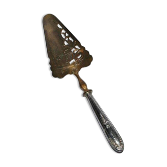 Antique silver-plated pie server with a brass blade decorated with roses.