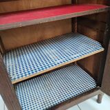 Bonnetière man standing cabinet a door